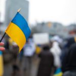 Ukrainian flag on the background of the rally. No war. Support f