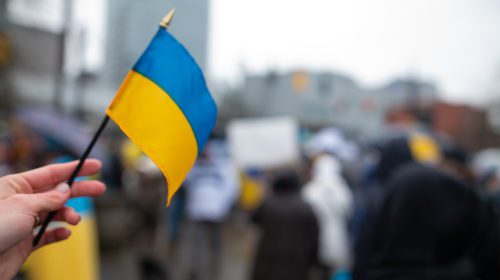 Ukrainian flag on the background of the rally. No war. Support f